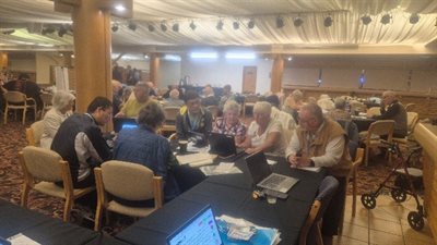 Group of people in a room set up for an event