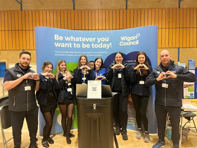 Be Well staff at a previous health event at Robin Park LC