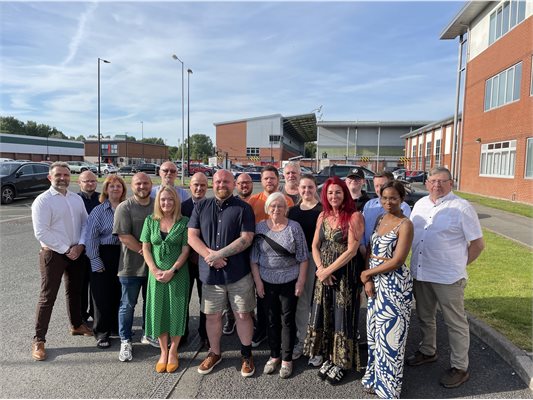 A group of people stood outside Leigh Sports Village