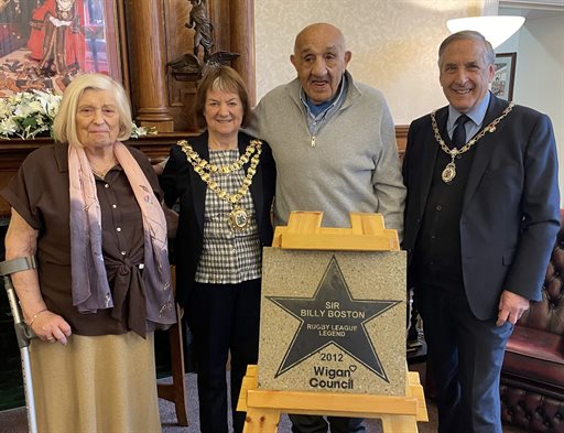 Sir Billy Boston receives his updated Believe Star