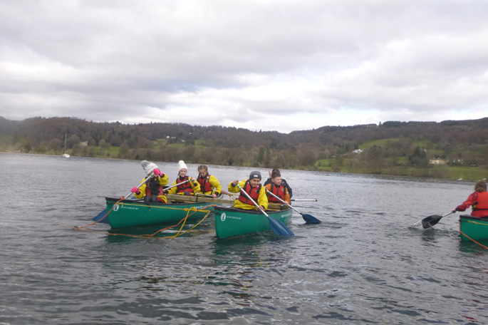 Students canoeing on Lake Coniston
