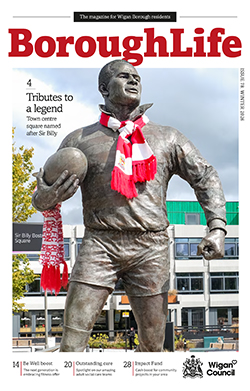 Borough Life Winter 2026 front cover with an image of the Billy Boston statue draped with a red and white scarf