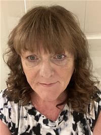 Woman with curly brown hair