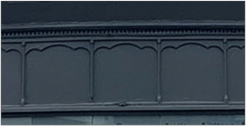A row of horizontal windows covered up in black so no light can get through