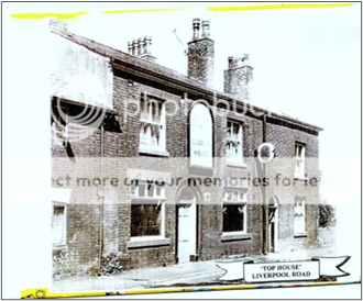 A black and white photograph, probably from the 29th Cenury showing the old Top House Pub.  A brick two-storey building with a central arched doorway and a large arched pub sign above with two windows on each floor either side.