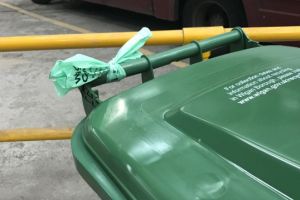 Tie liner around bin