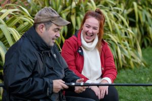 Tanfield support worker fishing with a man