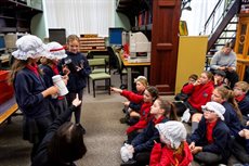Group of school children listening to a talk